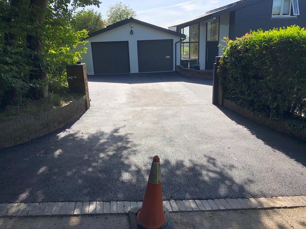 This is a photo of a bitumen driveway which is in the process of being installed by Sunbury Road Tech