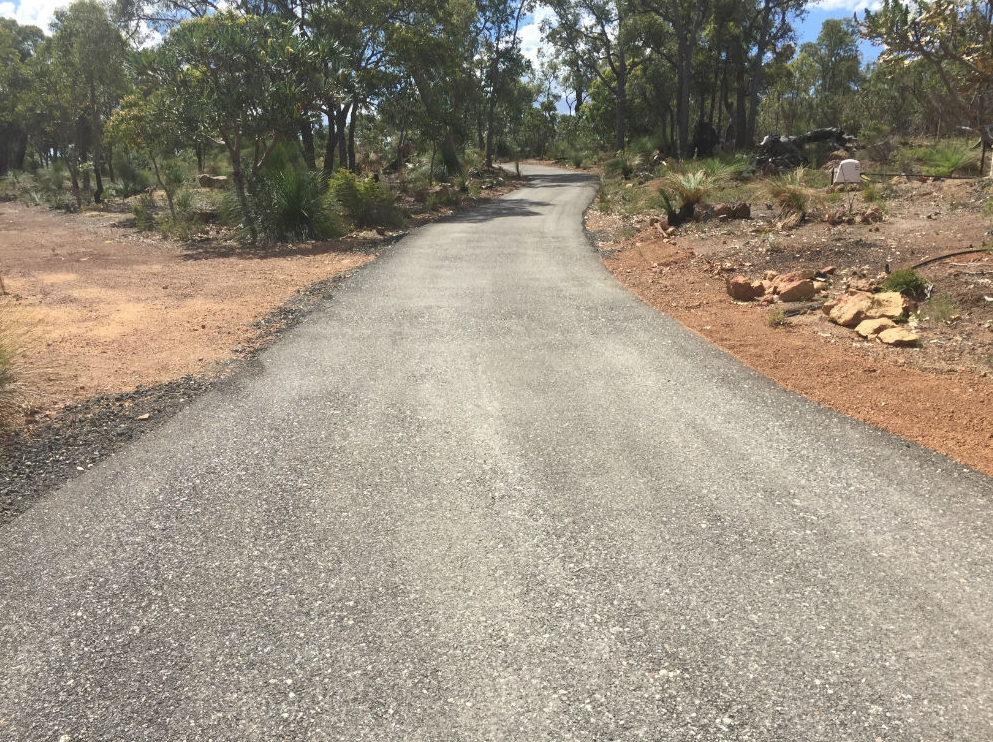 This is a photo of a hot spray & seal bitumen driveway which is in the process of being installed by Sunbury Road Tech