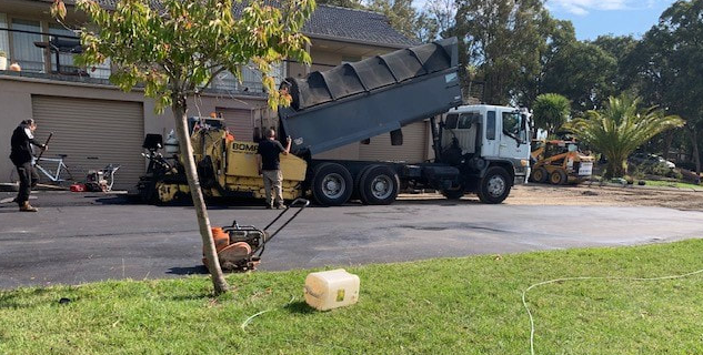 This is a photo of an asphalt driveway which is in the process of being installed by Sunbury Road Tech